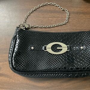 Guess patent leather wristlet or small bag.